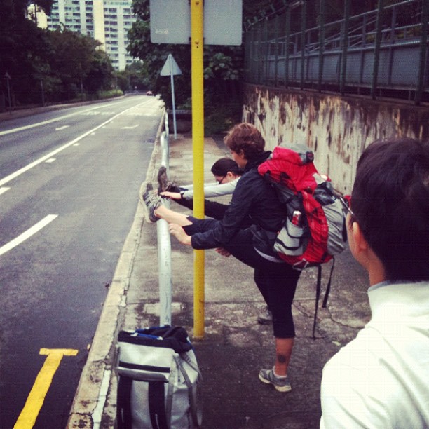 Stretching before we start walking to the crag...