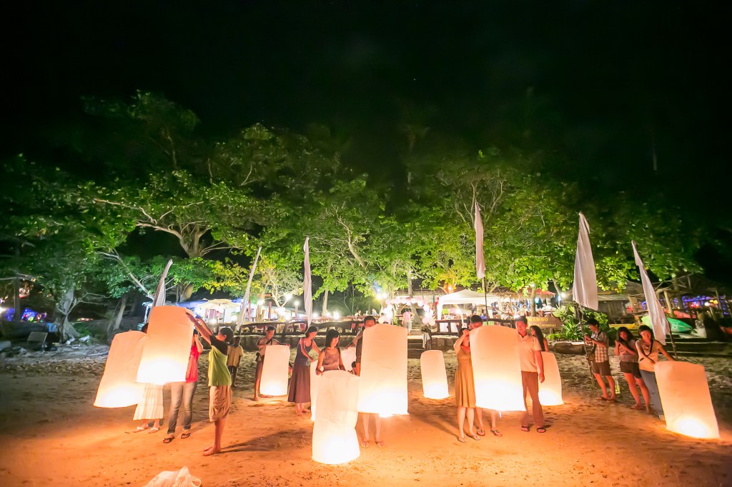 Setting off lanterns after everyone is half drunk during my wedding party last Dec (Photo by Garick Bay)