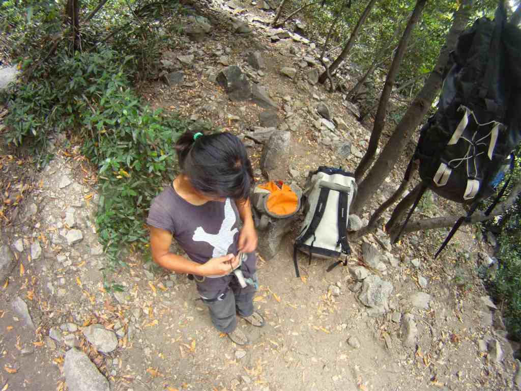 That's the bivy spot, we split the loads into half and harness up for the 4th class which feels more like exposed 5.5 climbing