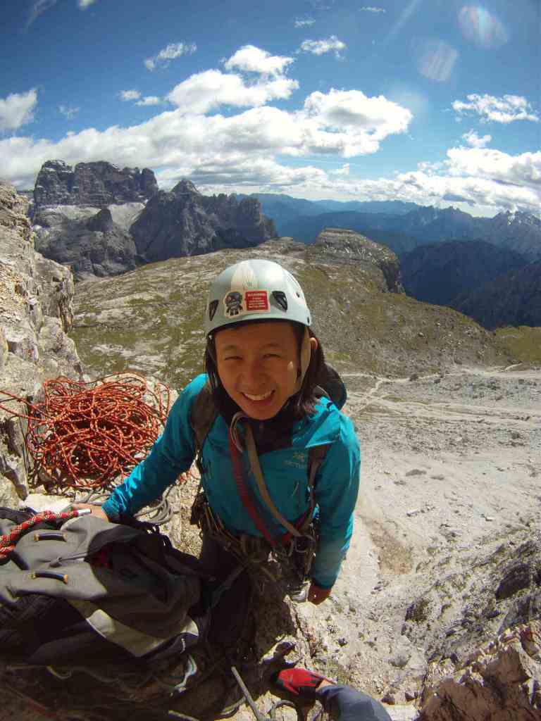 Kelly on top of second pitch and still smiling after being rained at with rocks. 