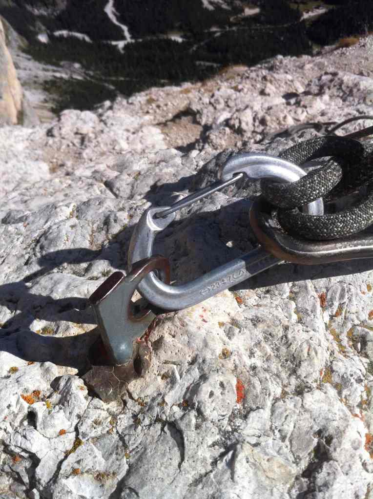 Single cemented pitons on the summit