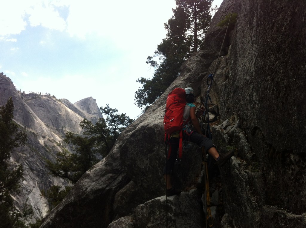 Kelly on the fix ropes hauling water and gear to the start of the climb